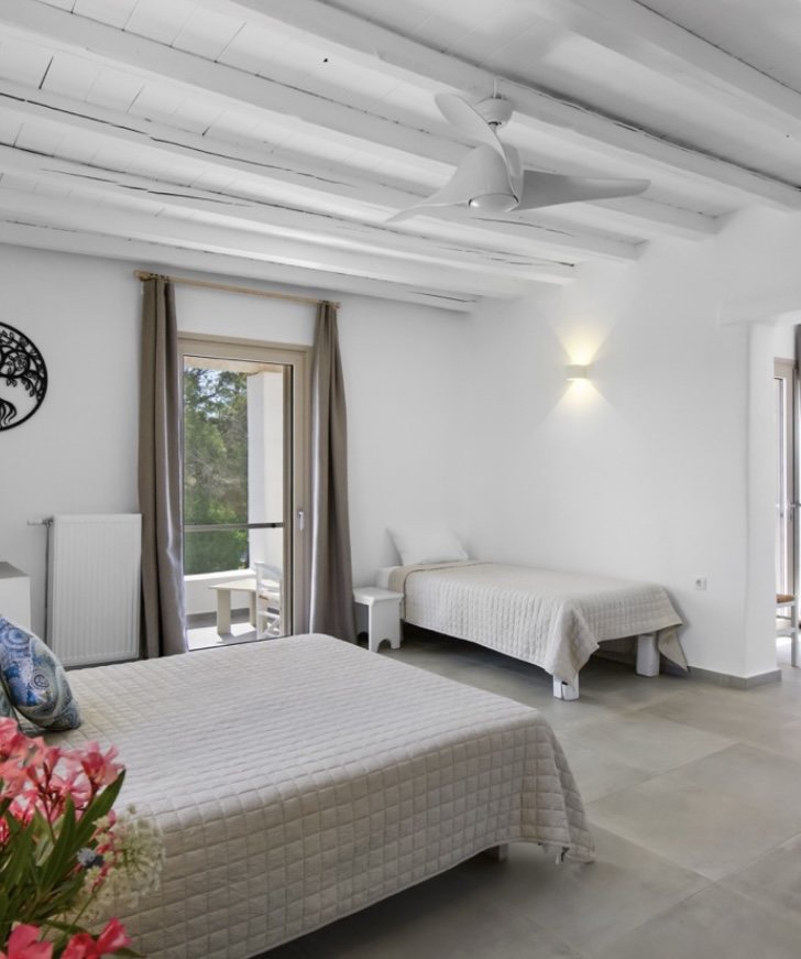 Bright room with double bed, single bed and balcony door