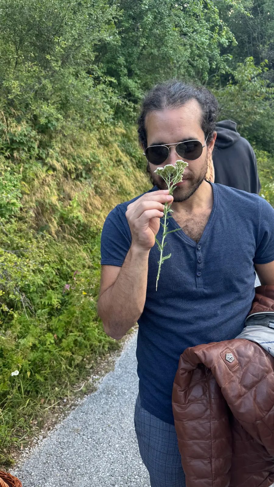 Smelling wild yarrow on the trail