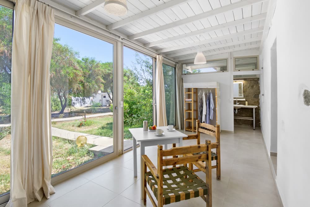Room interior with breakfast table and garden view