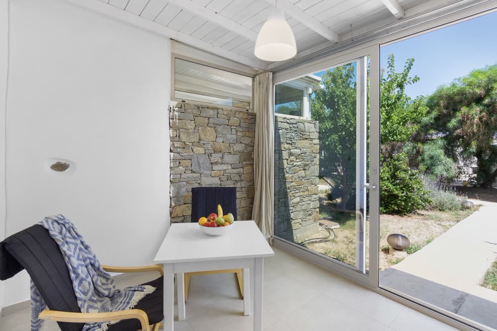 Corner nook with stone wall and fruit bowl by the garden