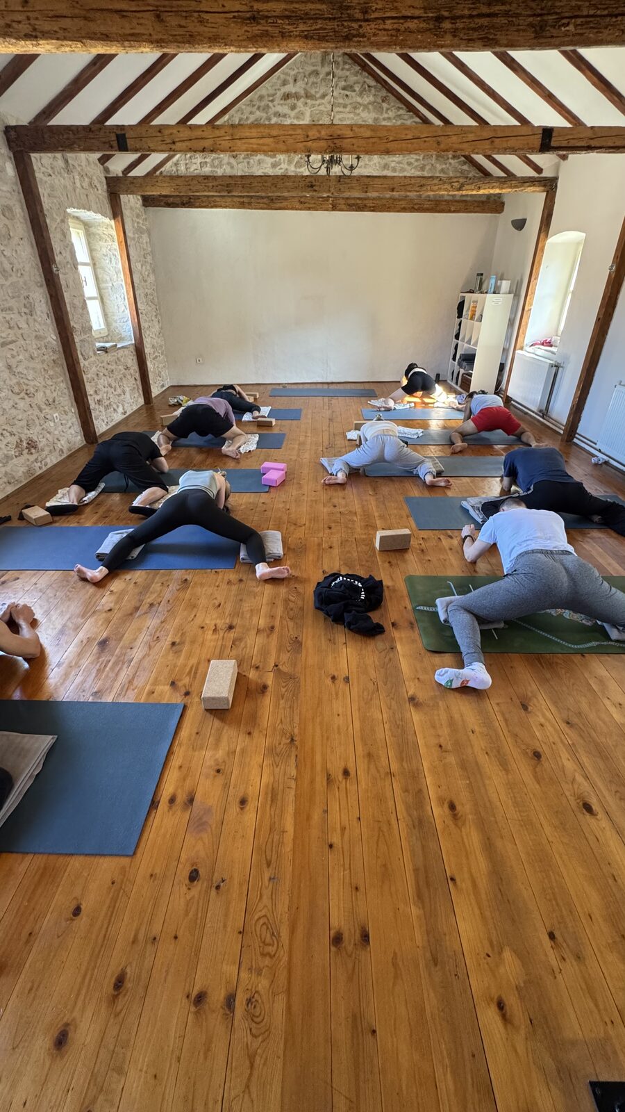 Group restorative practice on yoga mats