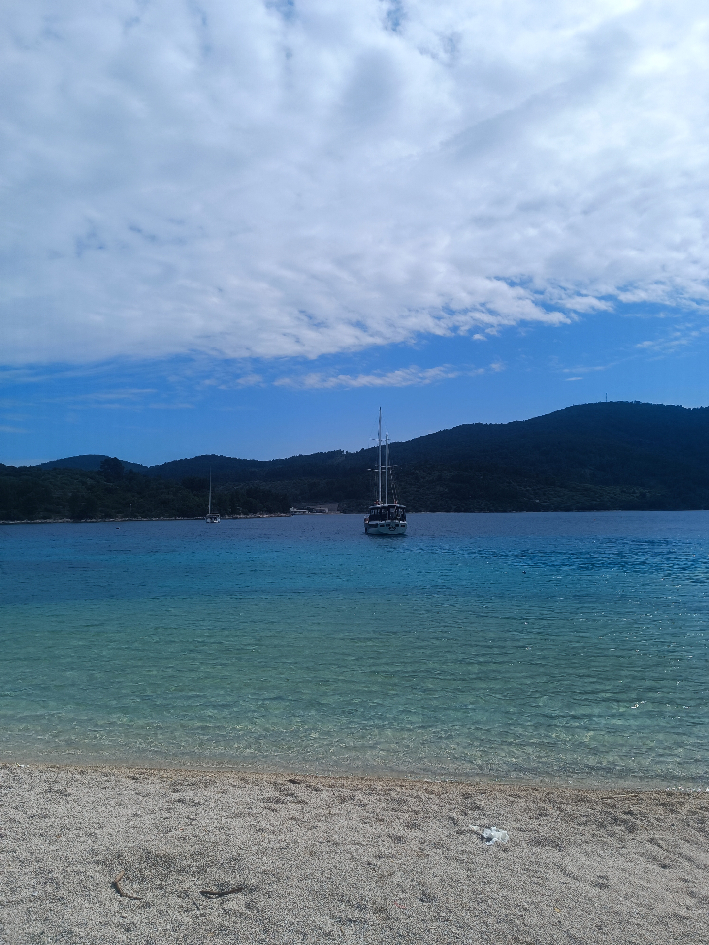 Sailboat anchored in a calm Korčula bay